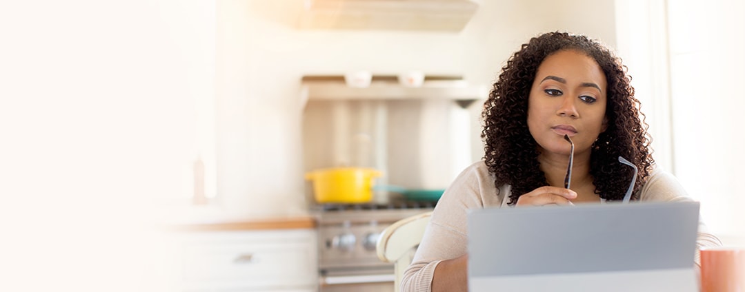 woman_with_laptop_thinking_1700x600